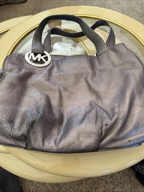 Michael Kors silvery Pebbled Leather Duffel with MK Charm